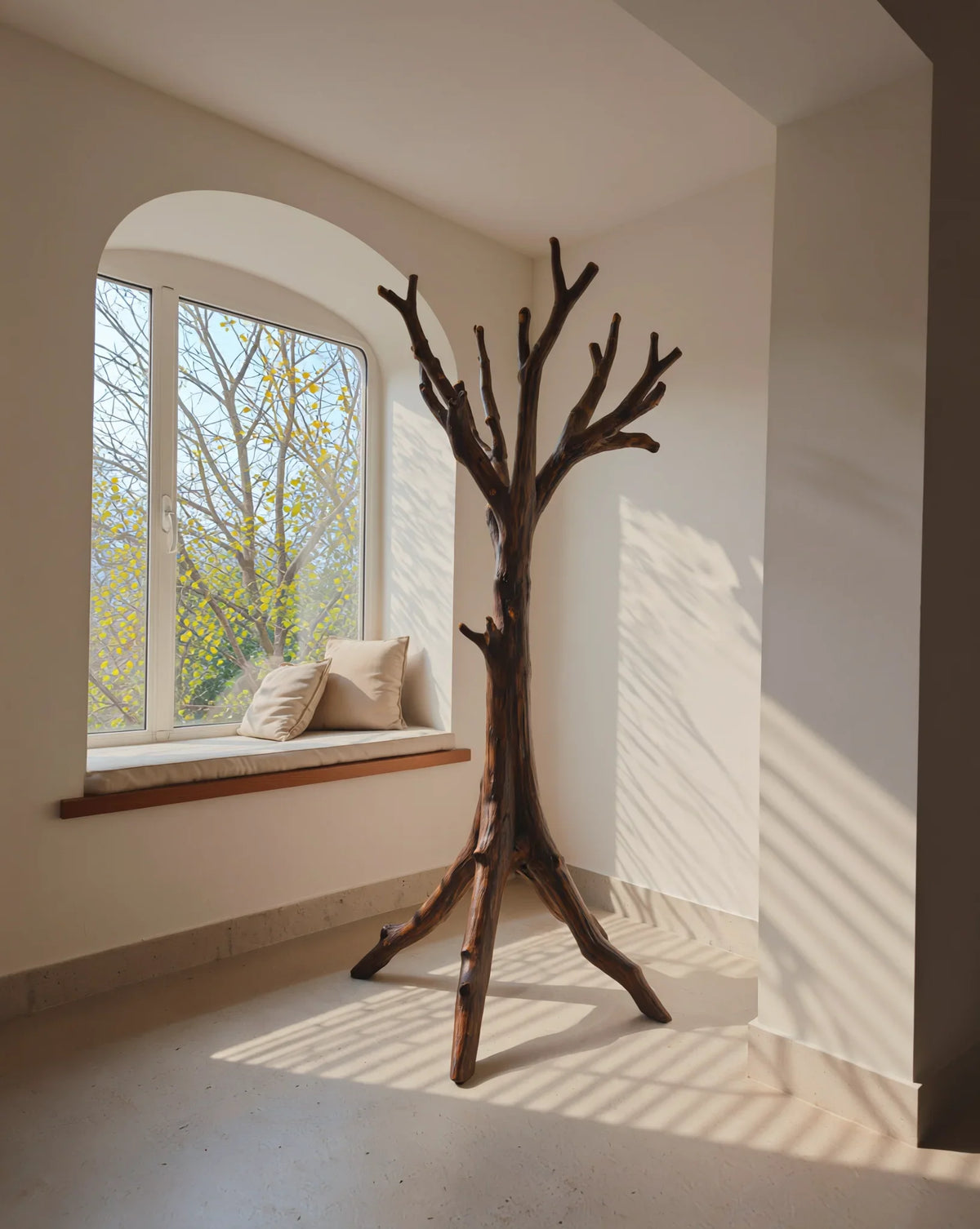 Solid wood tree-shaped bookshelf in modern room with window seat and neutral decor