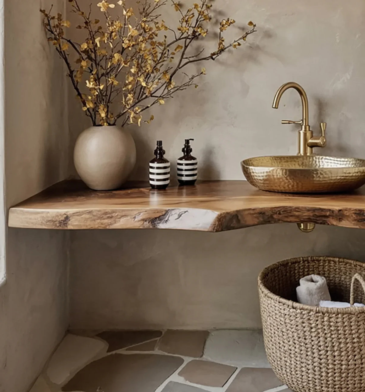 Live edge solid wood bathroom vanity with gold vessel sink, modern faucet, and natural decor