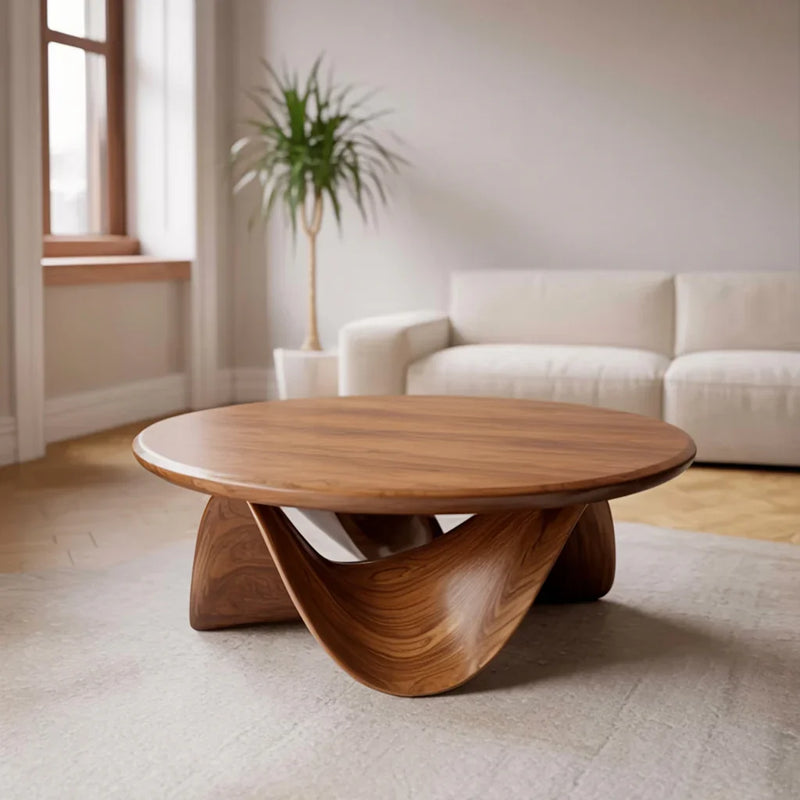 Modern solid wood live edge coffee table with sculptural base in bright living room