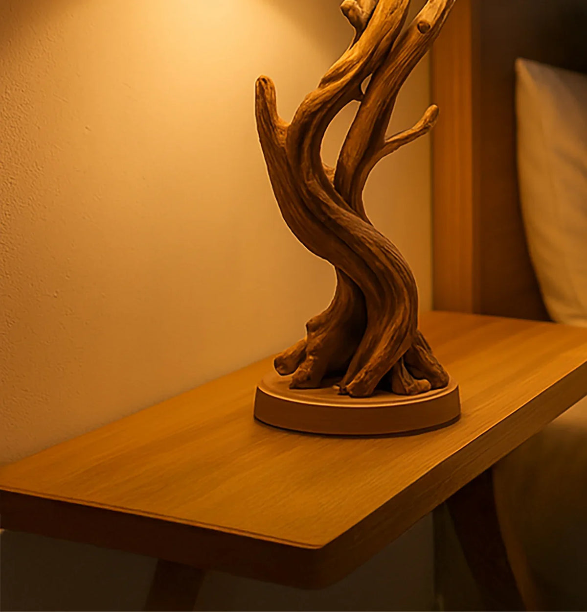 Sculpted driftwood bedside lamp on a solid wood floating nightstand