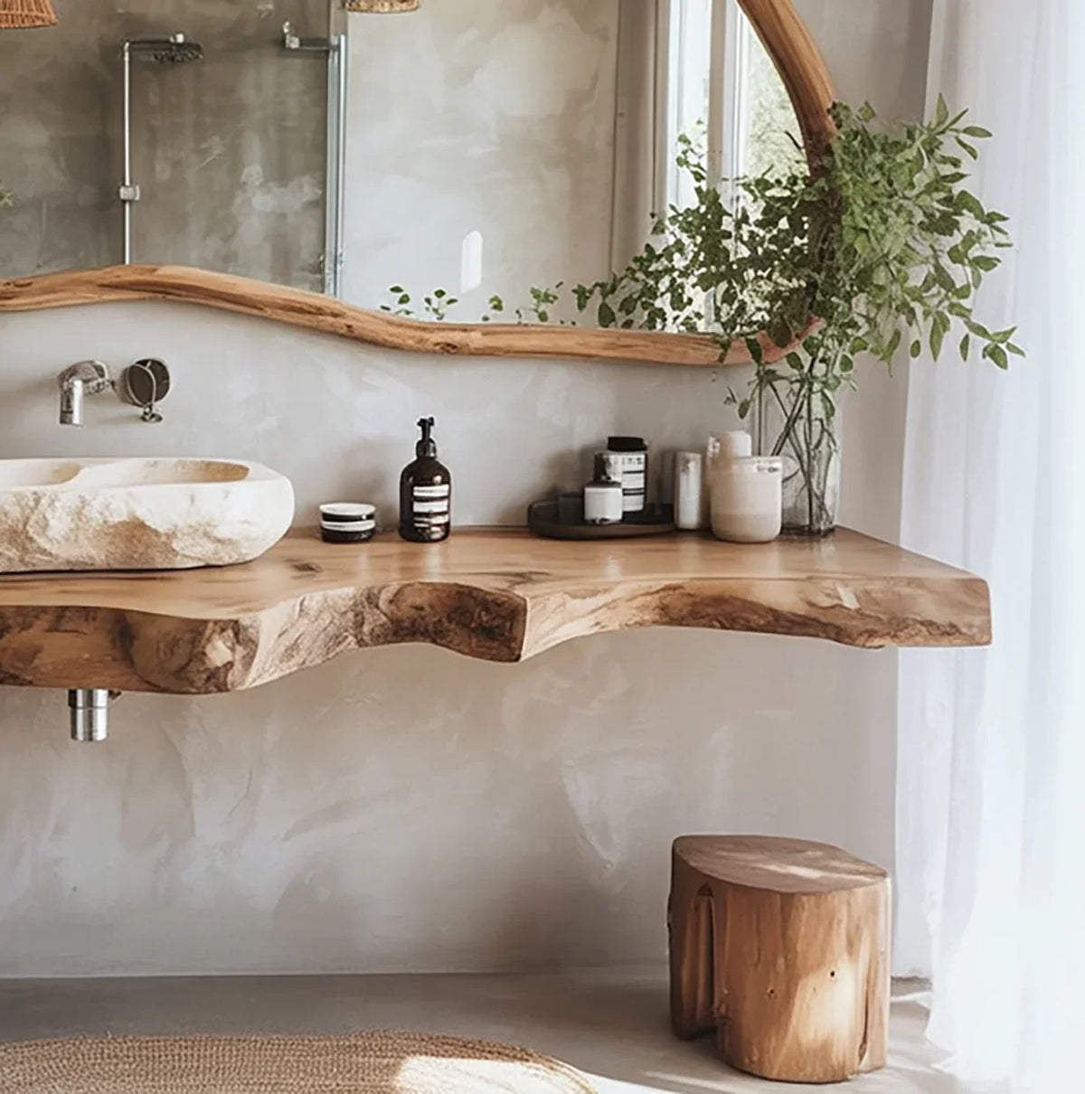Live edge wood bathroom vanity with stone sink, large mirror, and indoor greenery