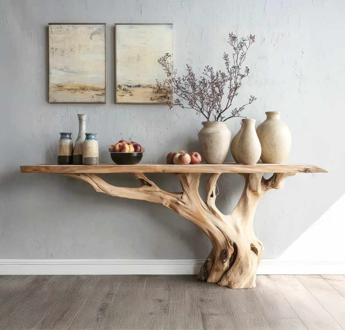 Live edge solid wood console table with natural tree base, decorated with vases and fruit bowls