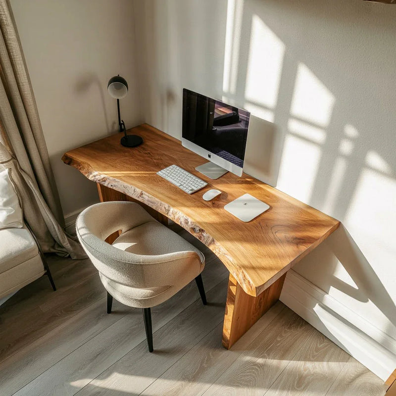 Live edge solid wood desk in bright home office with computer and modern chair