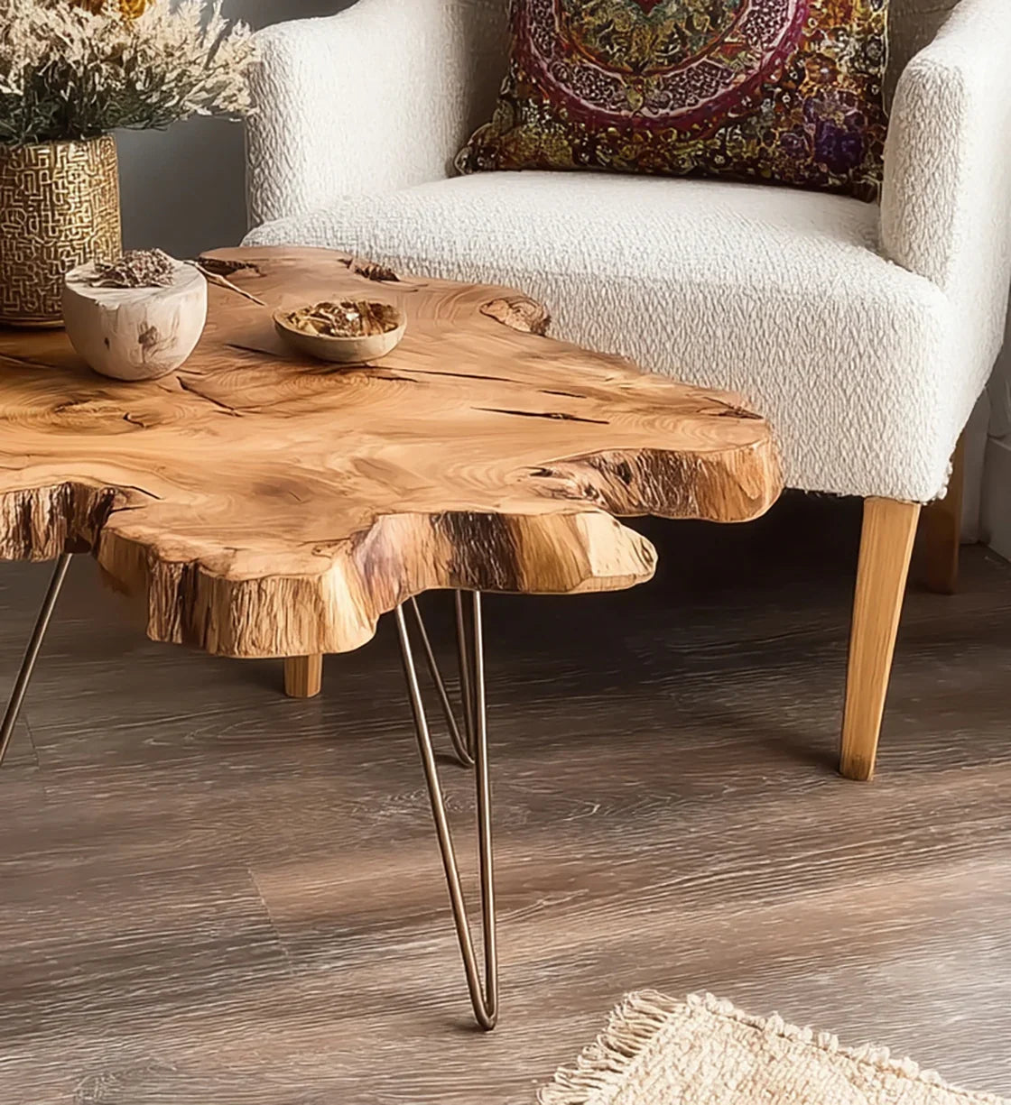 Rustic live edge wood coffee table with metal hairpin legs in cozy living room with white armchair