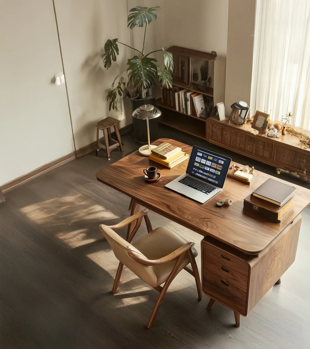 Modern home office with a solid wood desk, laptop, chair, bookshelf, and natural light