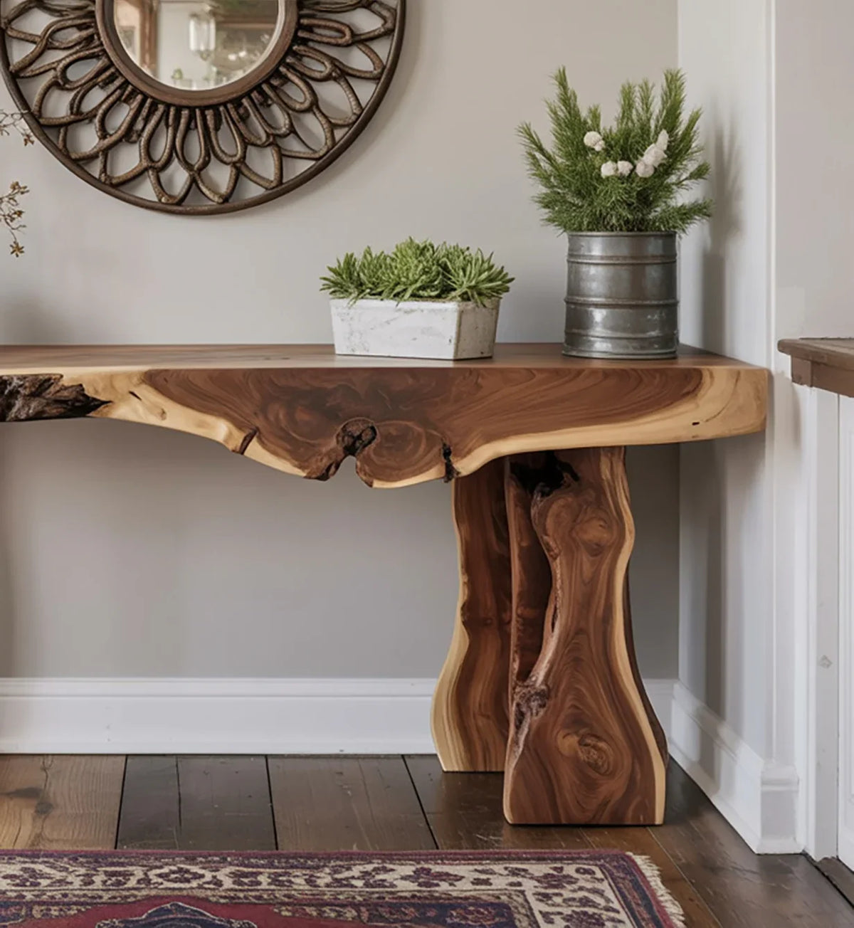 Live edge wooden console table with potted greenery and decorative round mirror on cream wall