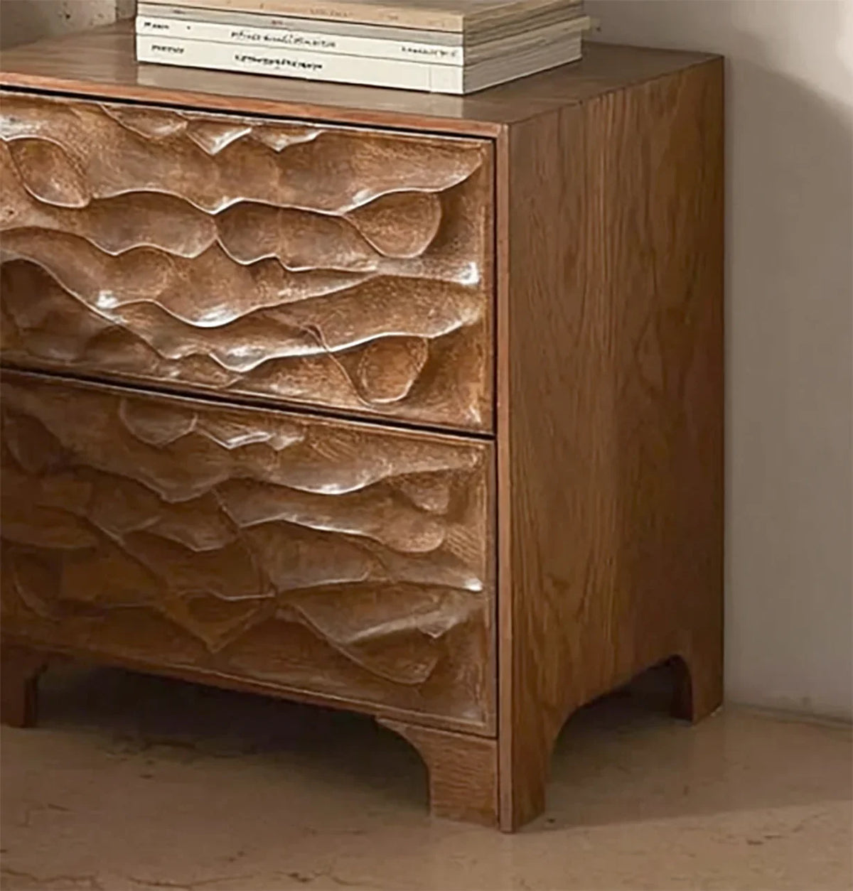 Solid wood nightstand with sculpted wave-pattern drawers, sustainable furniture design