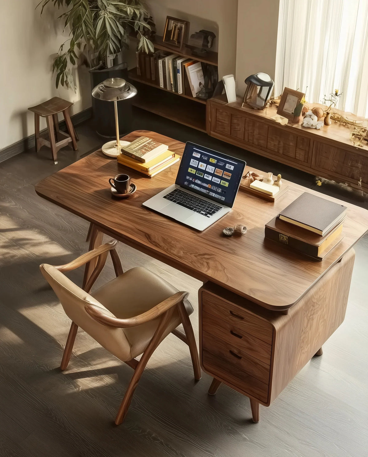 Modern home office with a solid wood desk, laptop, books, and natural light