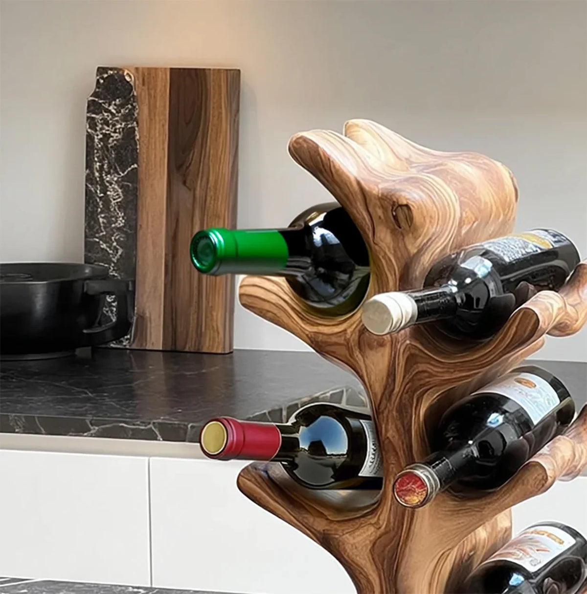 Handcrafted solid wood wine rack with natural live edge design holding wine bottles on a kitchen counter