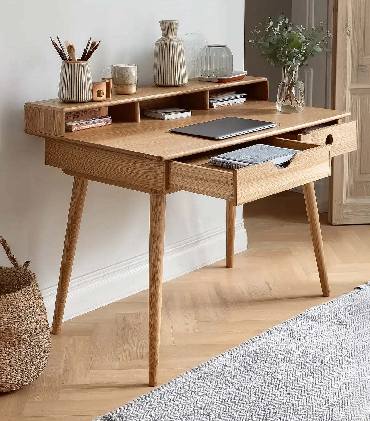 Solid wood writing desk with drawers, open shelves, and minimalist decor in a modern room