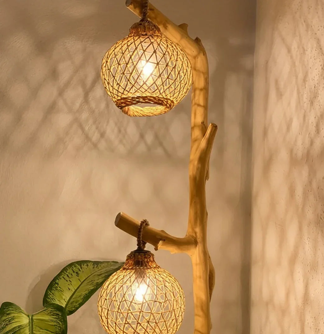Handcrafted wooden floor lamp with woven rattan globes and warm ambient lighting