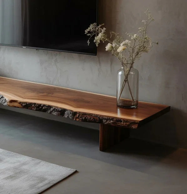 Minimalist living room with natural wood floating shelf and glass vase with dried flowers
