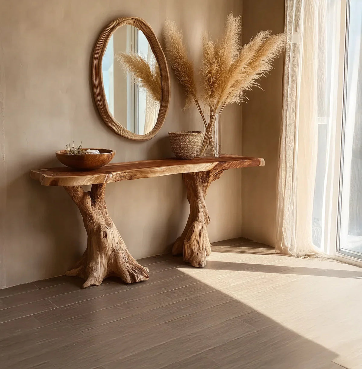 Rustic wooden console table with natural tree trunk legs, round mirror, dried pampas grass, and beige decor