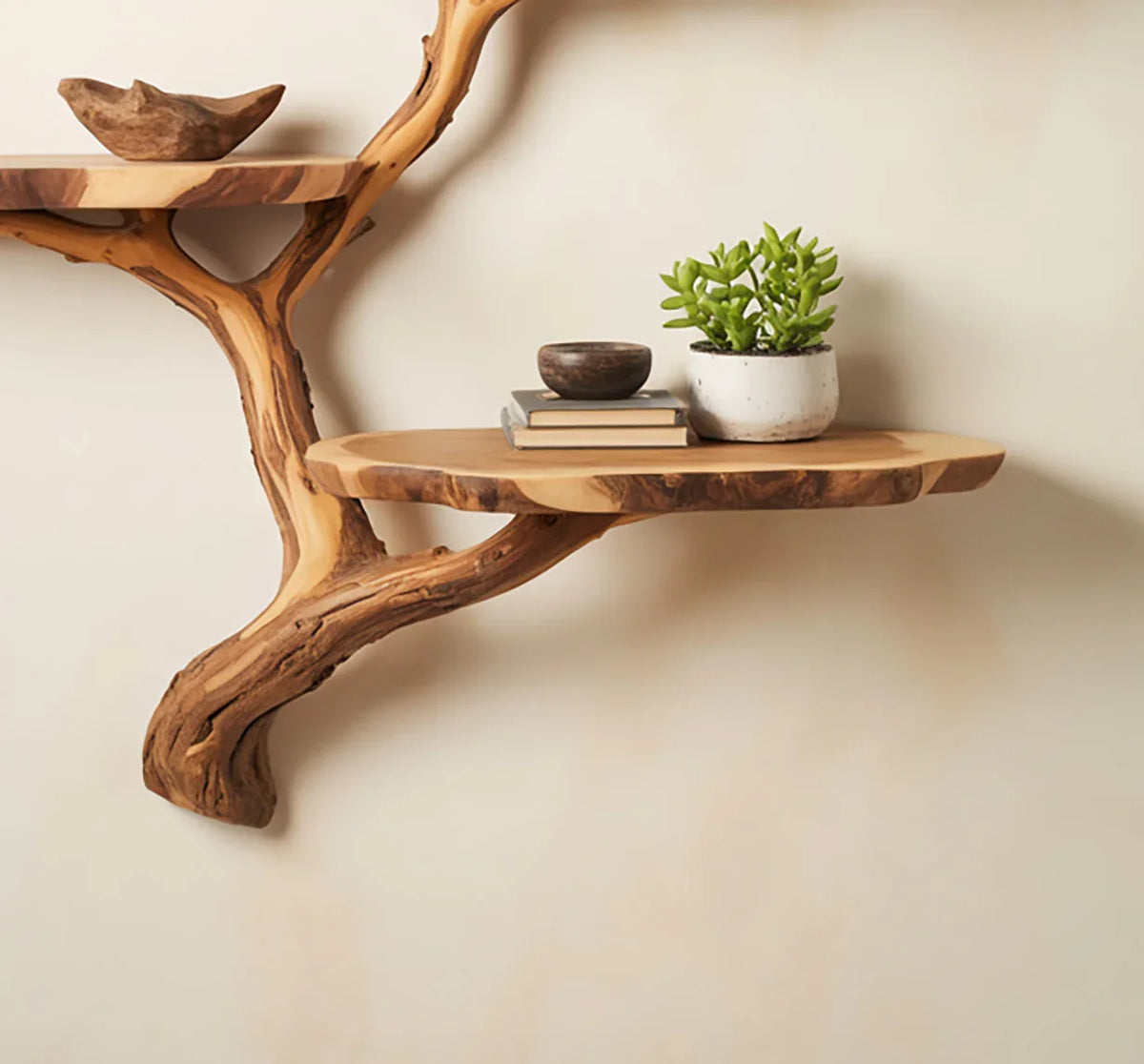 Live edge wooden tree bookshelf with floating shelves, books, bowl and potted plant