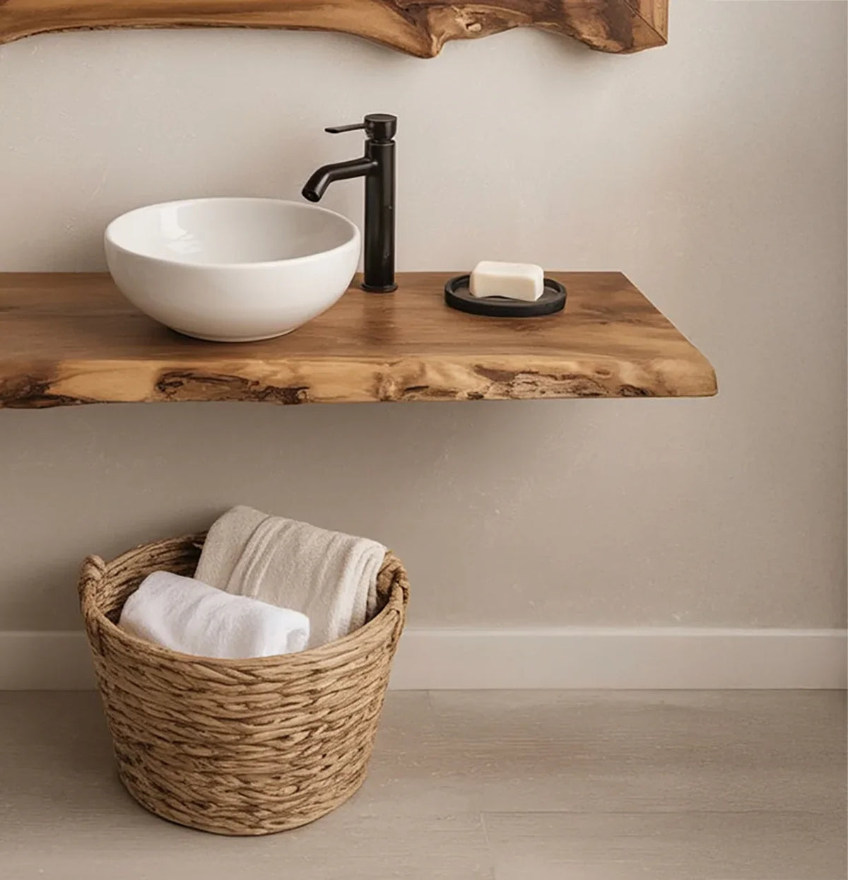 Live edge wood floating shelf vanity with vessel sink, modern faucet, and basket with towels