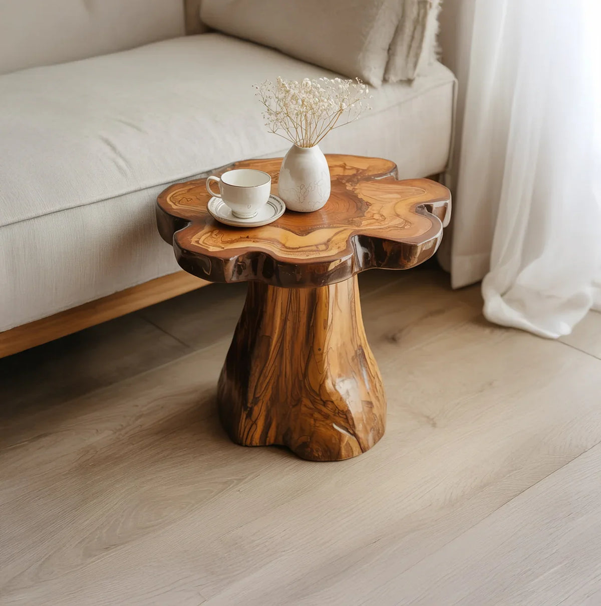 Live edge solid wood side table with natural finish beside sofa, cup and vase on top