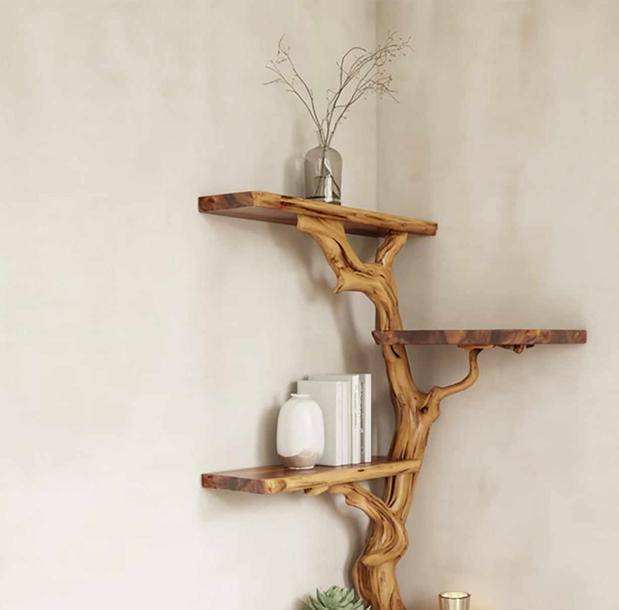 Tree branch-inspired wooden wall shelves with books, vase, dried branches, and decorative items