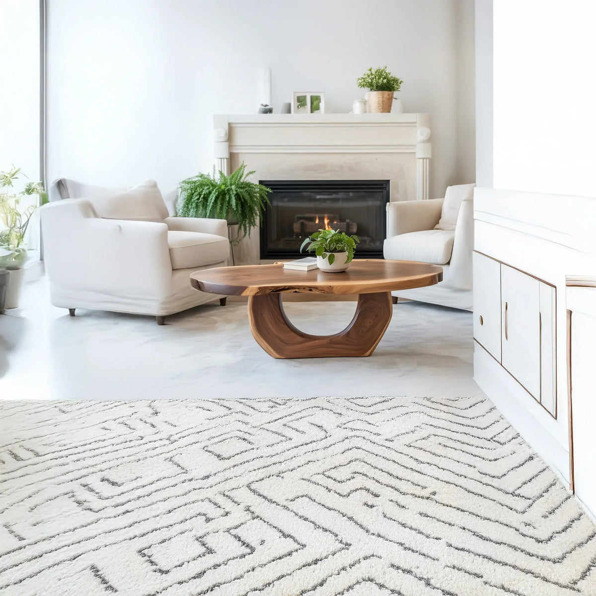 Solid wood live edge coffee table in modern living room with white armchairs and fireplace