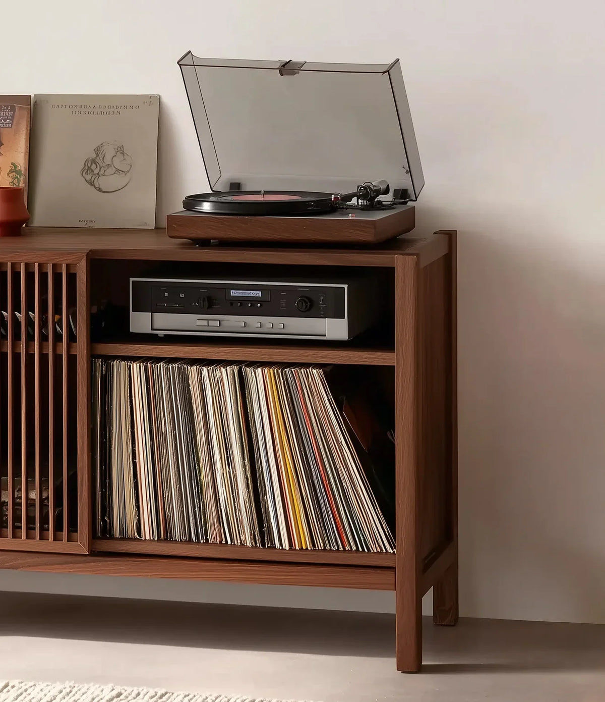 Solid wood media console with a record player, vinyl records, and stereo system