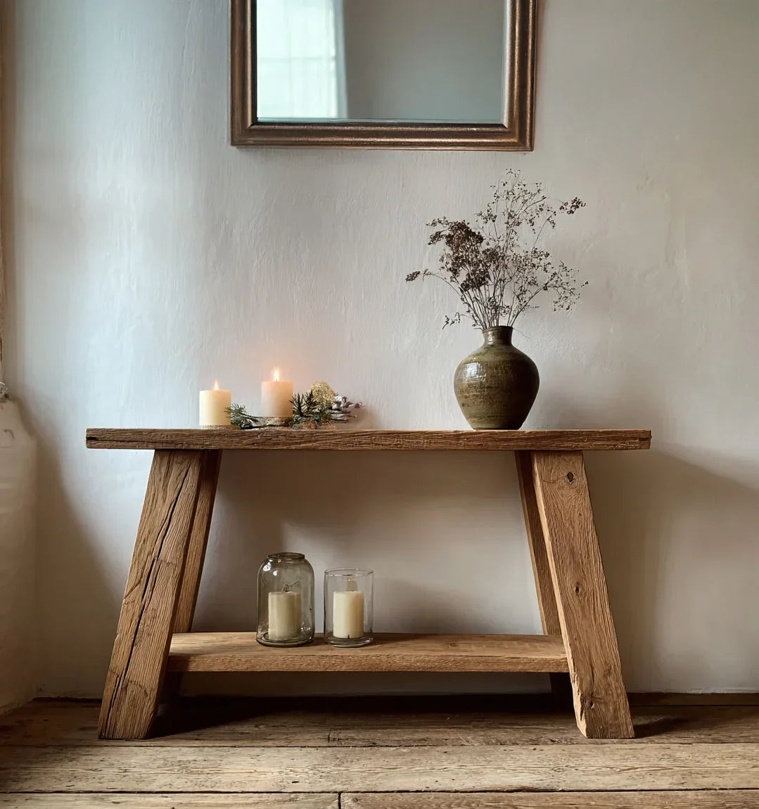 Solid wood console table with dried flowers in a vase and candles, rustic home decor
