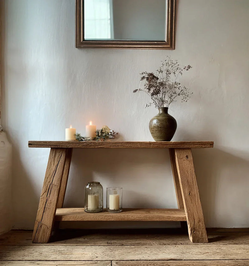 Solid wood console table with dried flowers in a vase and candles, rustic home decor