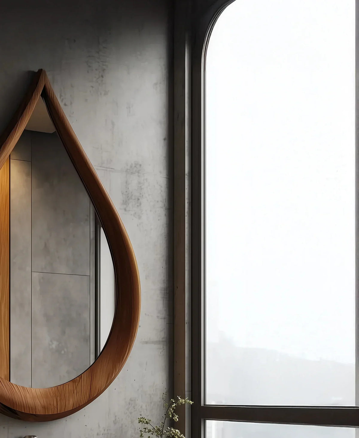 Modern bathroom with teardrop-shaped wooden mirror and large arched window
