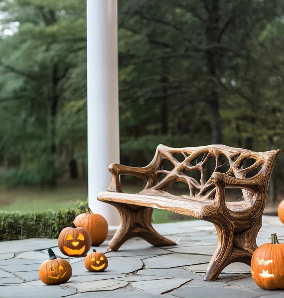 Decorative wooden garden bench on stone patio with carved smiling jack-o-lantern pumpkins