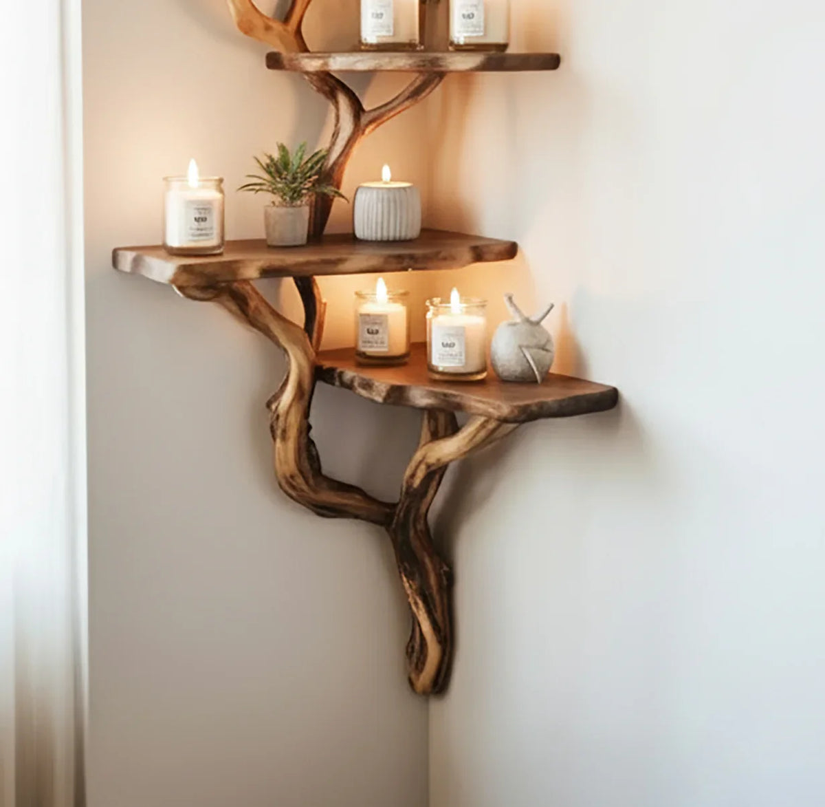 Rustic corner wood shelf with lit candles, small plant, and decorative objects on white wall