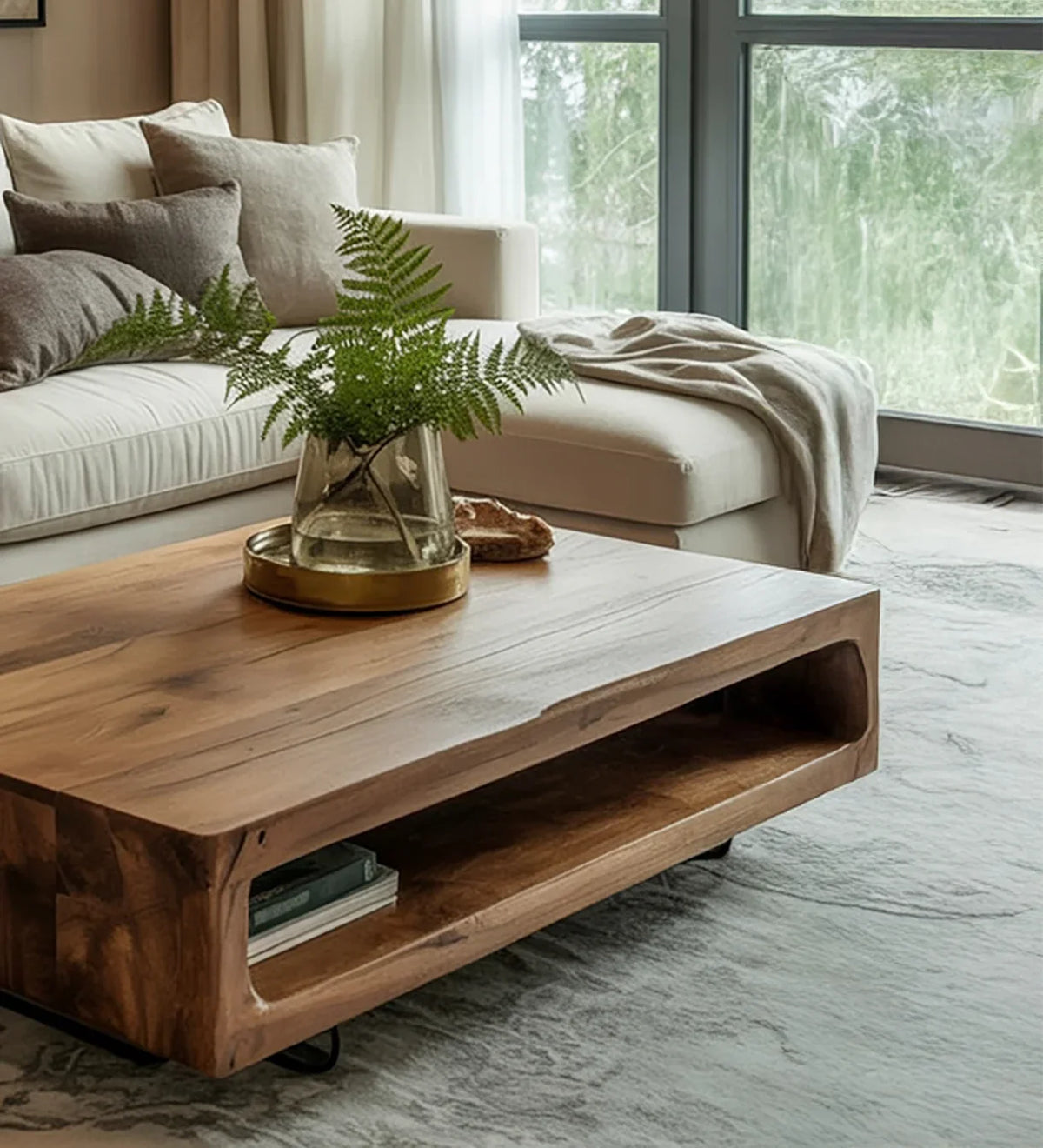 Modern living room with light beige sectional sofa, wooden coffee table, green fern in glass vase