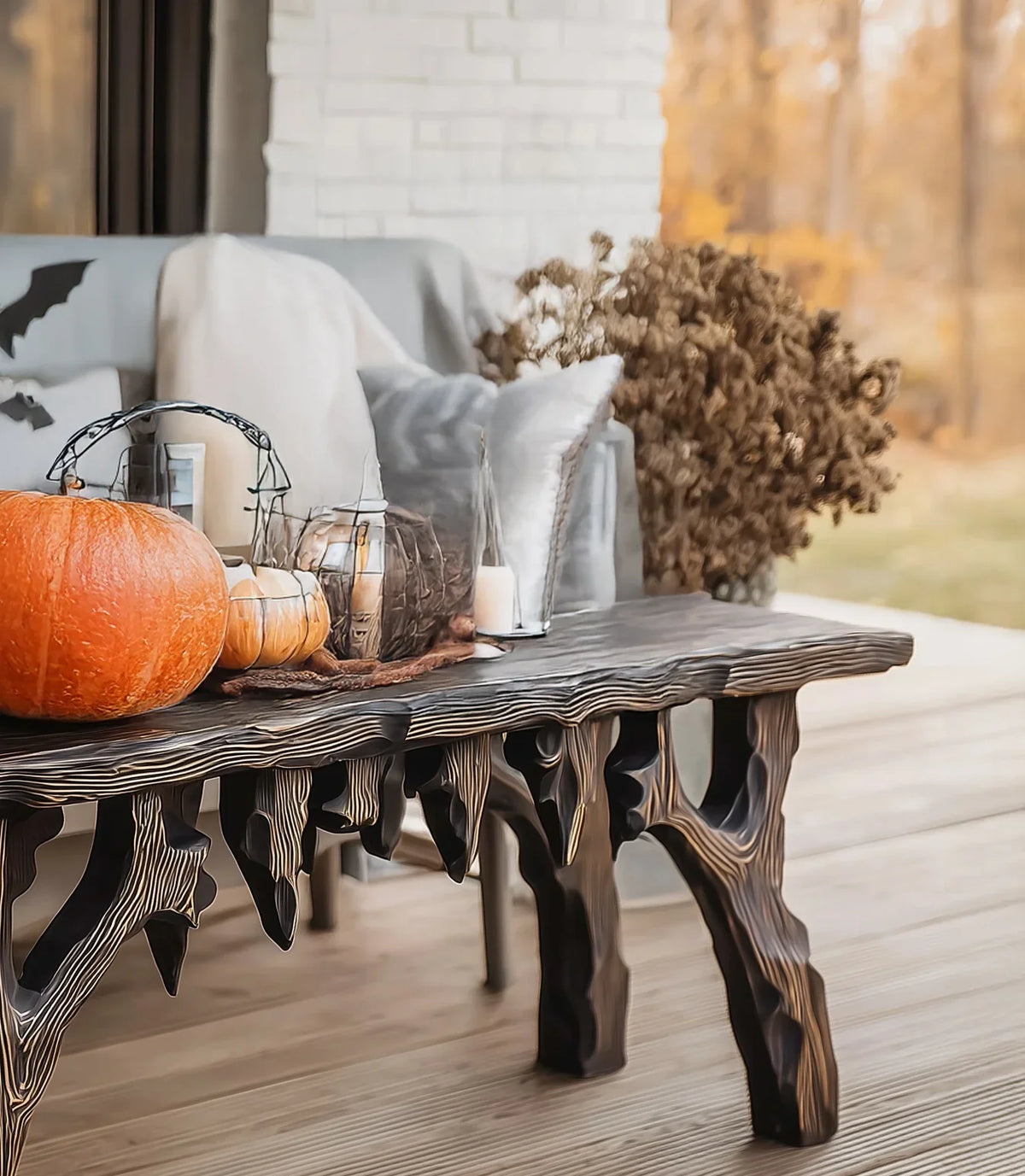 Sustainably crafted live edge wood table with pumpkin and fall decor on outdoor patio