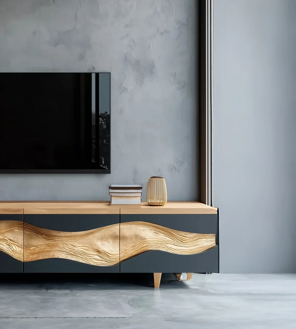 Modern solid wood TV console with gold live edge detail, books, and lamp in a minimalist living room.