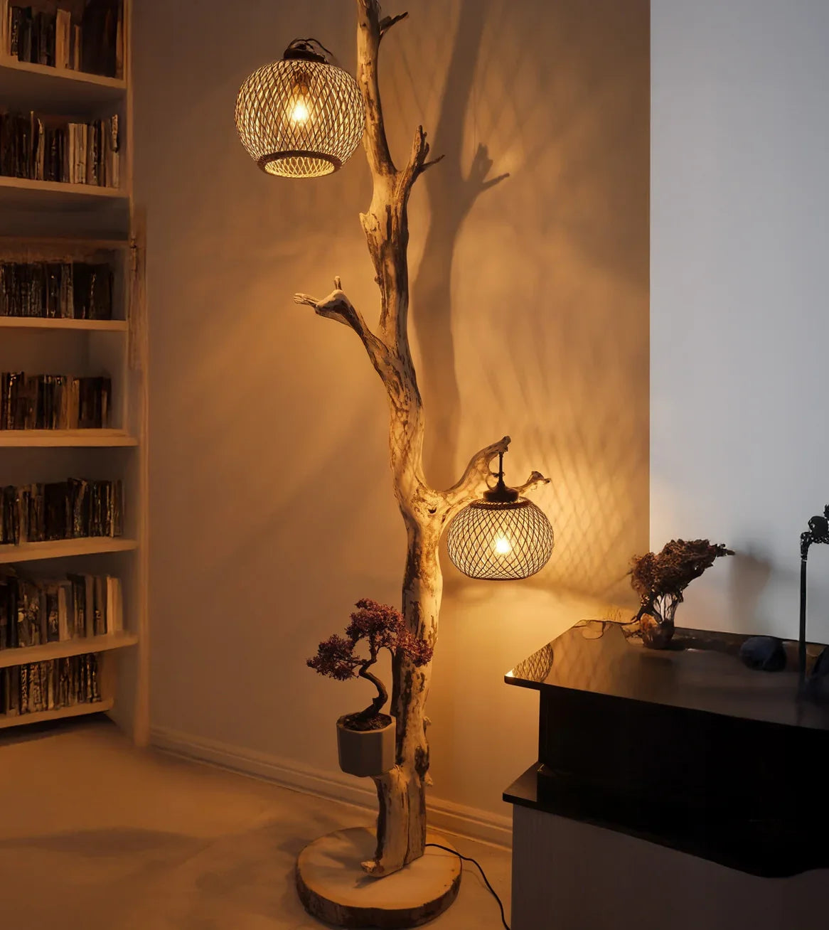 Live edge wooden floor lamp with mesh lampshades and potted plant in cozy room