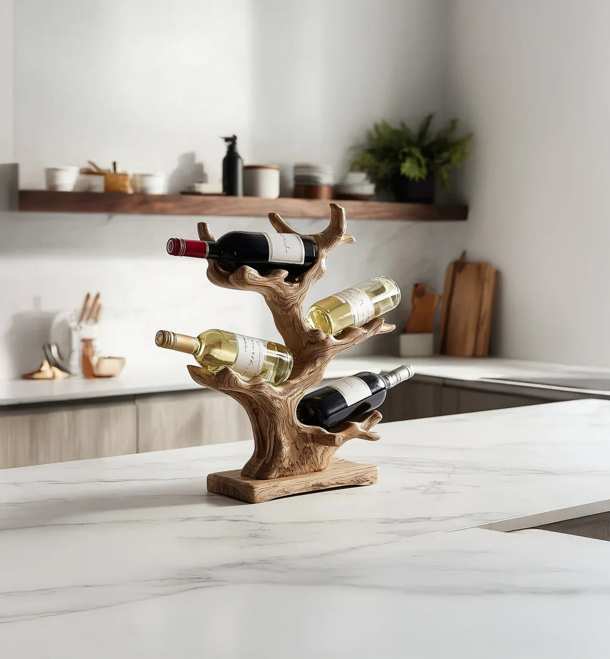 wooden tree branch wine rack on white marble kitchen countertop with four wine bottles