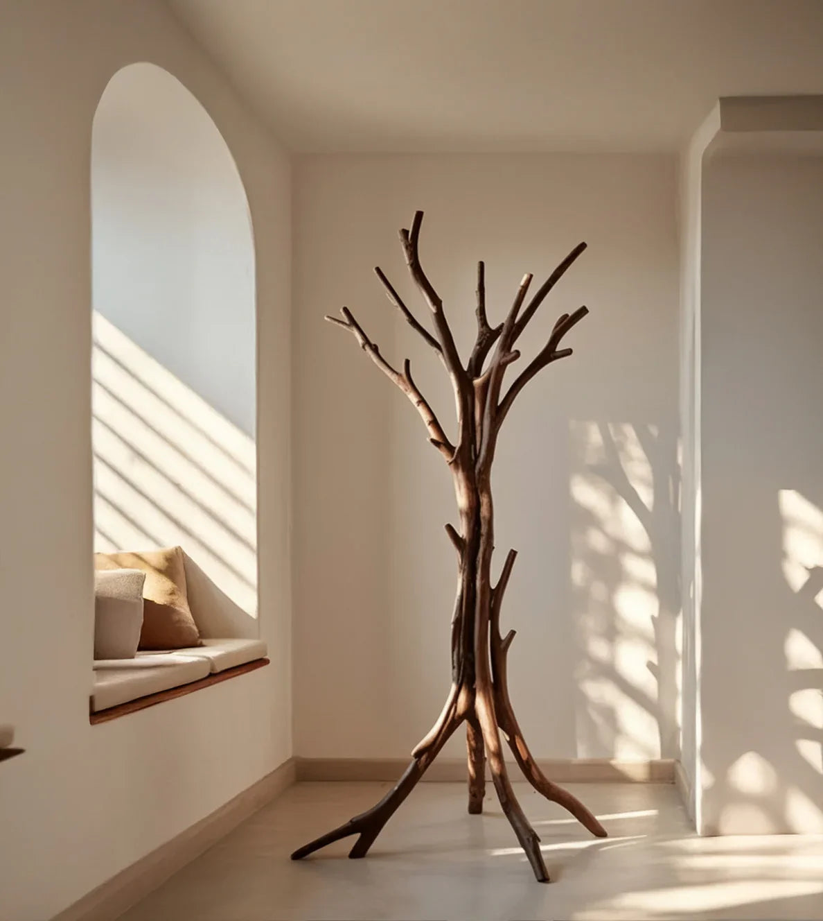 Minimalist room with a solid wood tree bookshelf, natural light, and cozy window seat.