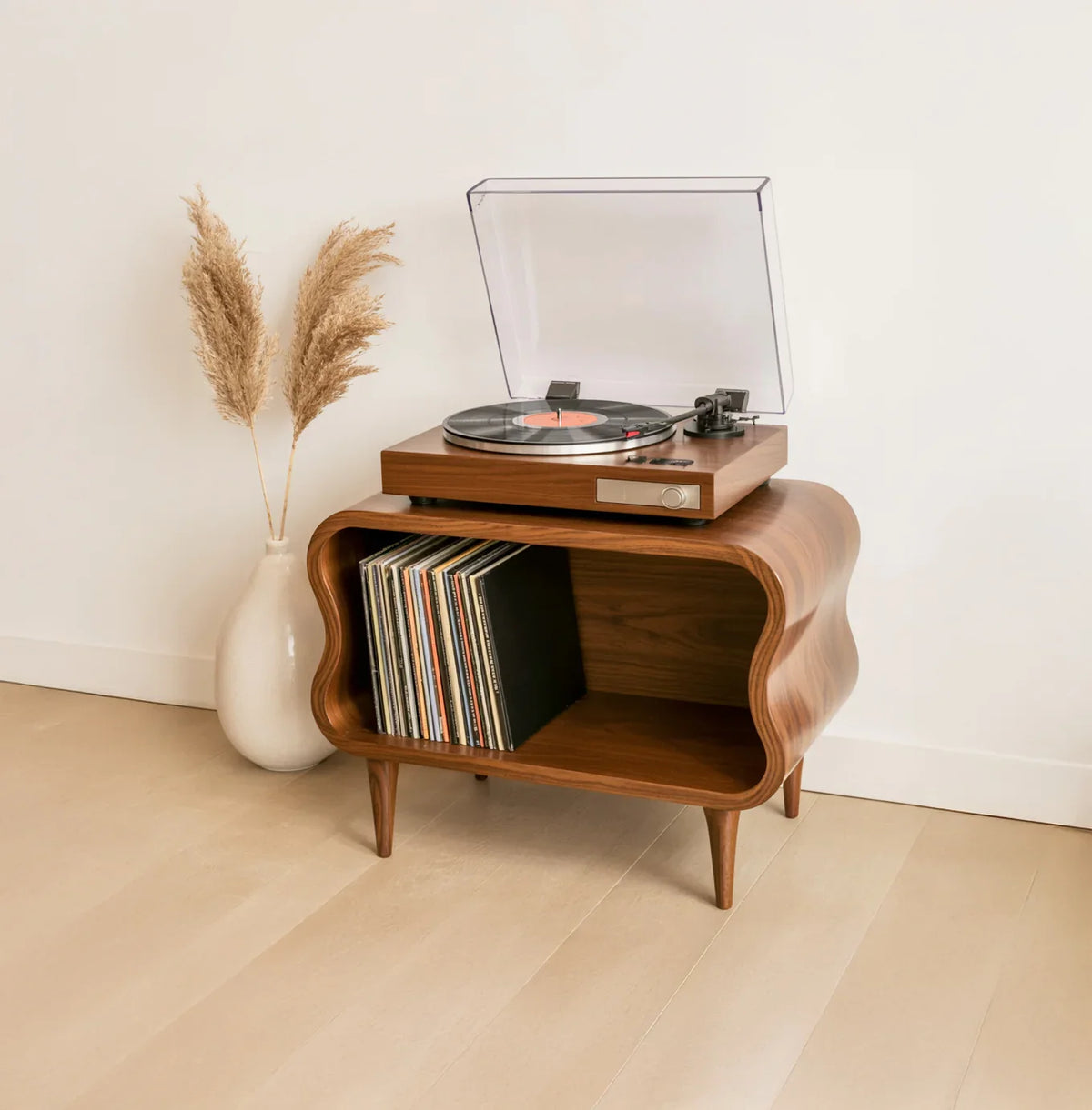 Solid wood record player stand with sculpted edges, vinyl storage, and modern decor