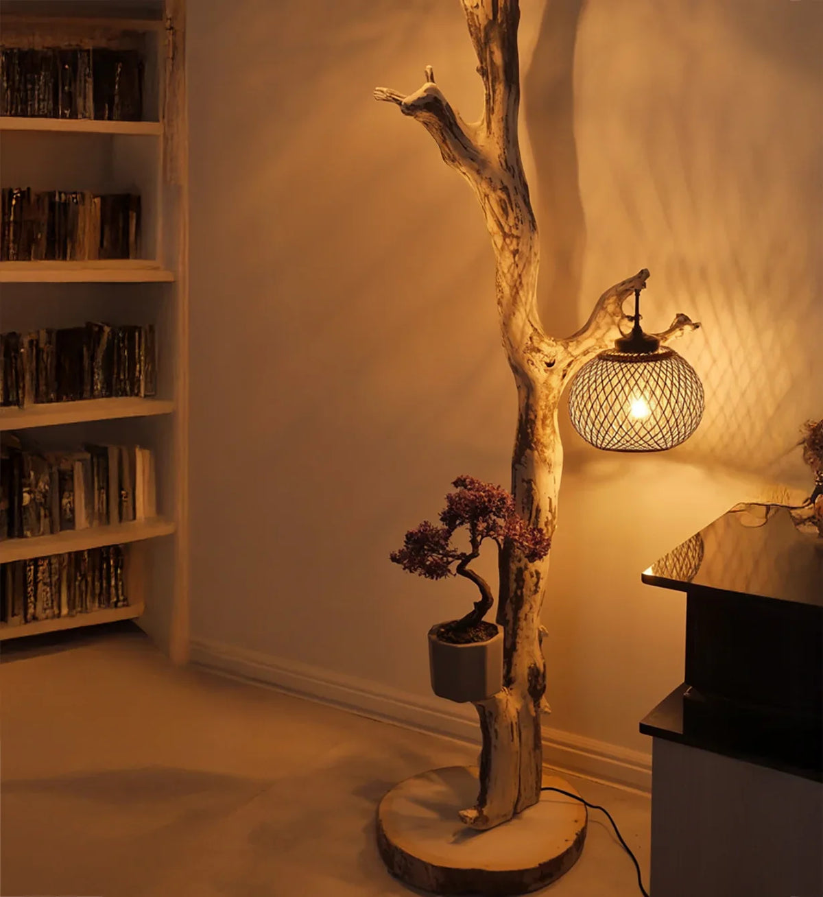 Rustic solid wood floor lamp with natural tree branch, mesh lampshade, and potted bonsai