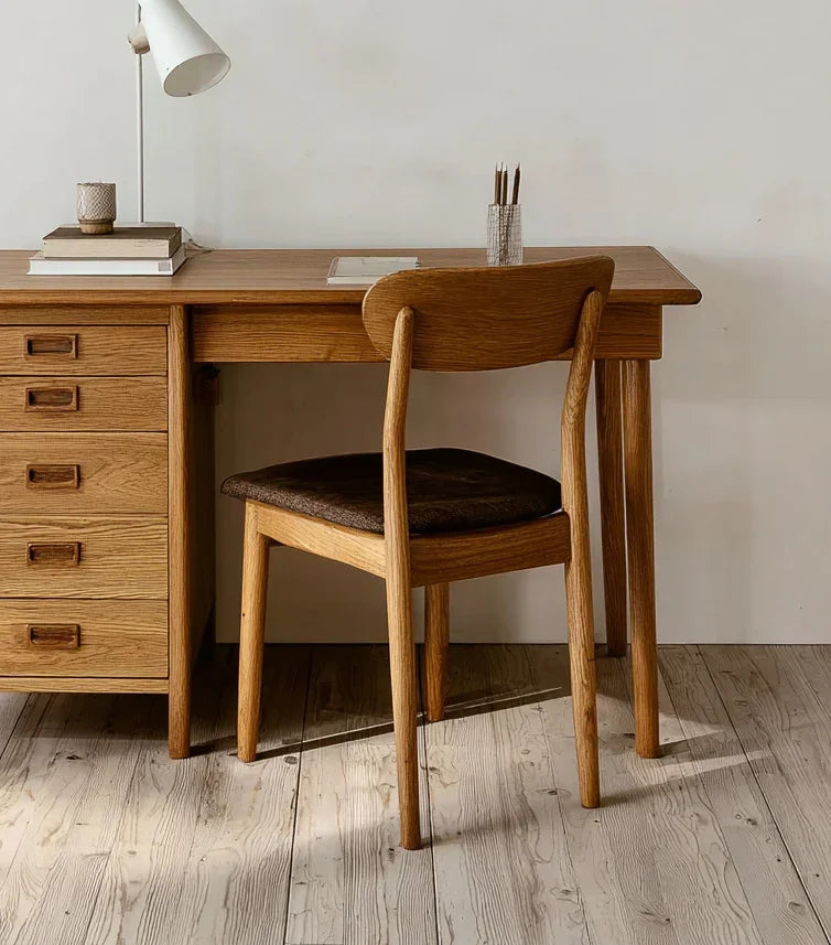 Solid wood desk and chair with minimalist design in a cozy home office setting