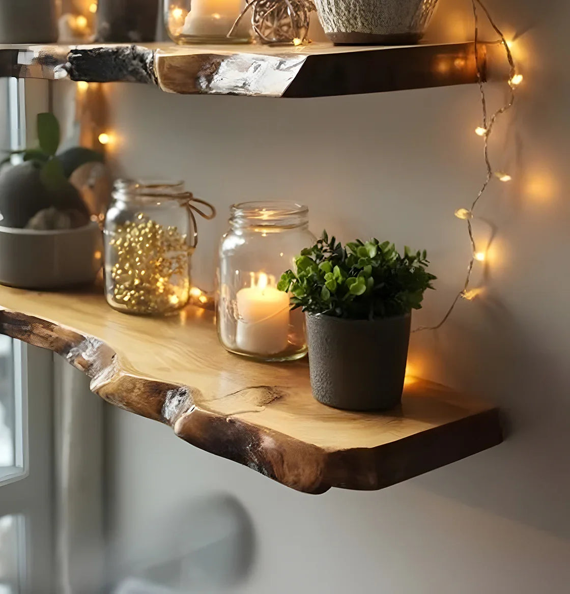 natural live edge wooden shelves decorated with potted plants, candles in jars, and warm fairy lights