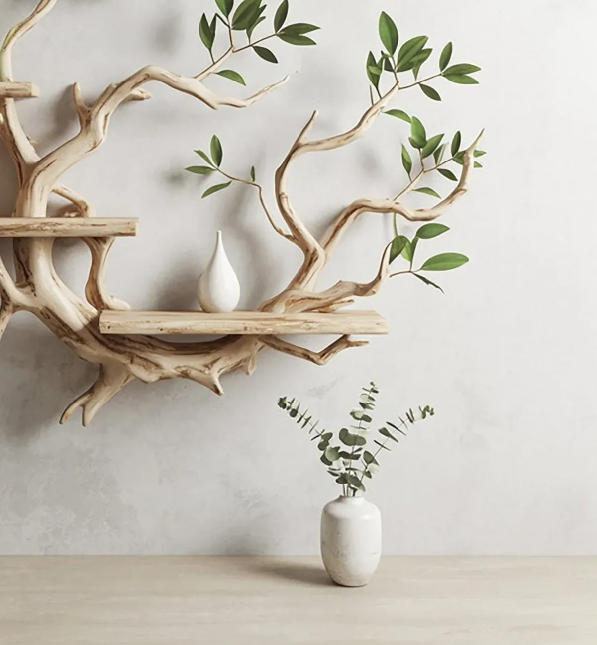 Wooden branch wall shelf with small white vase and green leaves, plus white ceramic vase with eucalyptus on table