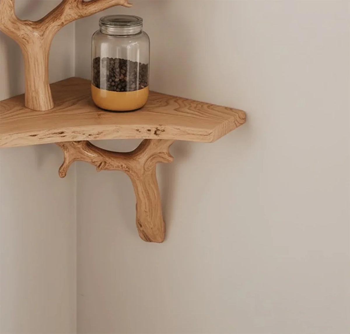 Solid wood corner shelf with natural tree branch supports and a glass jar on top