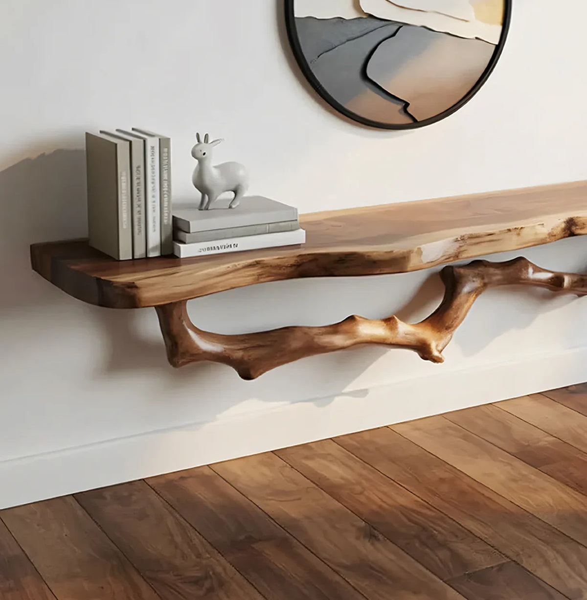 Live edge floating wood shelf with books and decor on white wall, modern minimalist interior.