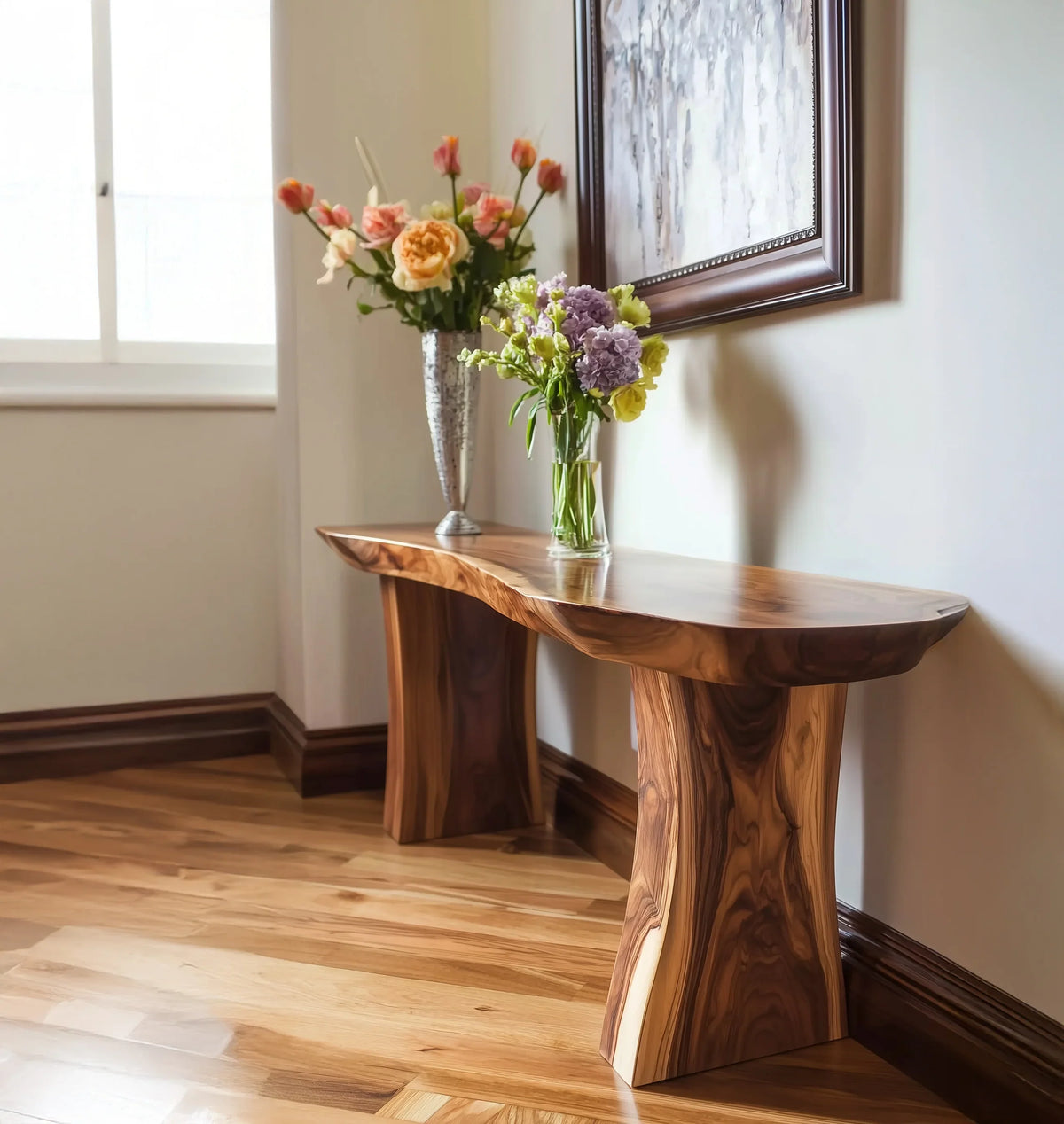 Live edge wood console table with floral arrangements in a bright, modern interior