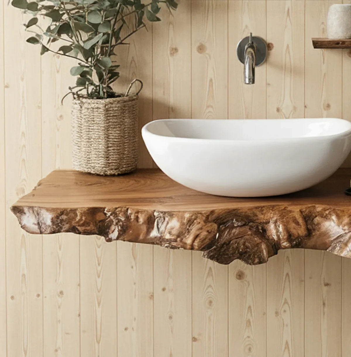 Modern bathroom sink with white basin on live edge wood countertop and woven plant basket