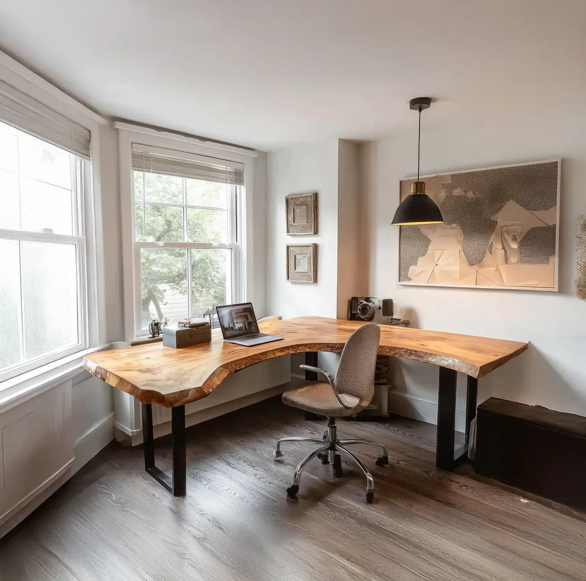 Live edge solid wood desk in bright home office with modern decor and large windows
