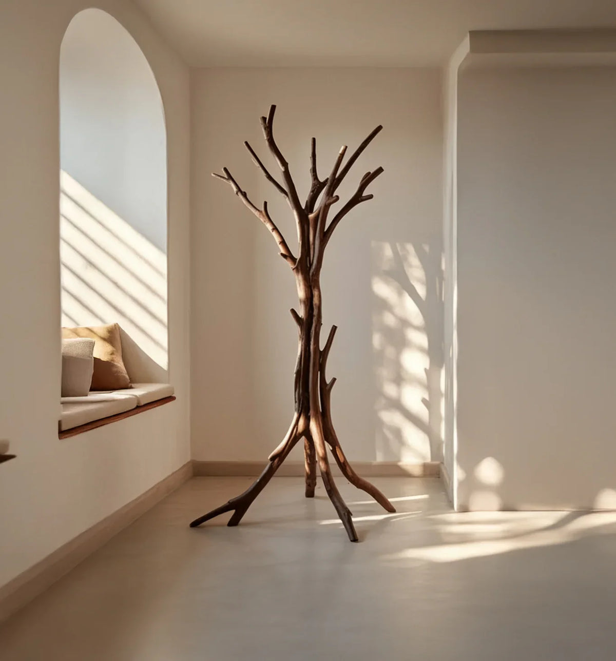 Solid wood tree bookshelf in modern minimalist room with arched window seat and natural light.