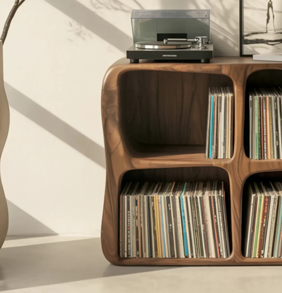 Solid wood vinyl record storage shelf with rounded edges and turntable on top