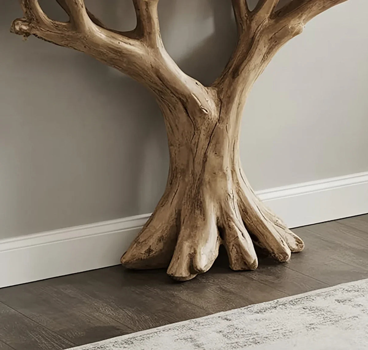 Solid wood tree-shaped bookshelf base, live edge design, on hardwood floor