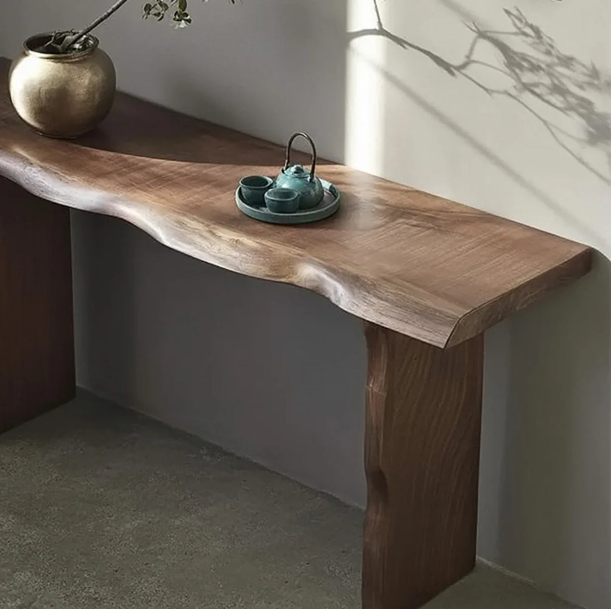 Live edge solid wood console table with natural finish in minimalist room