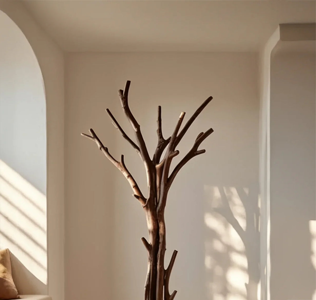 Live edge solid wood tree bookshelf in a minimalist sunlit room with neutral walls