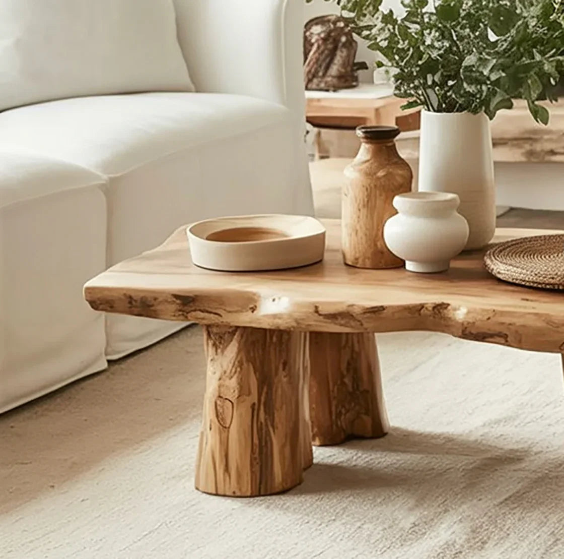 Live edge solid wood coffee table with natural finish, rustic decor, and ceramic vases